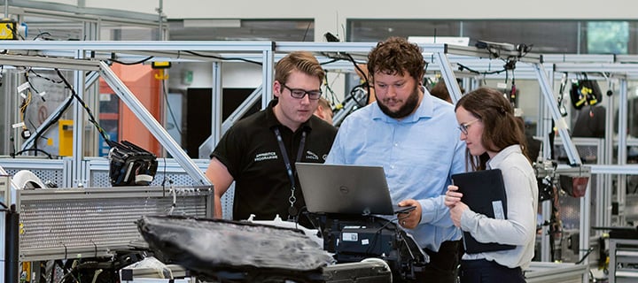 Engineers looking at laptop